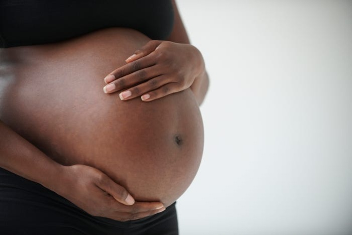 pregnant dark skinned woman